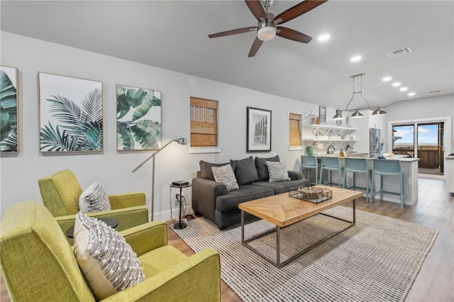 living room featuring ceiling fan and light hardwood / wood-style flooring