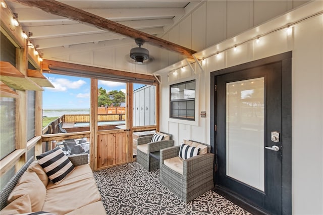 sunroom with vaulted ceiling with beams