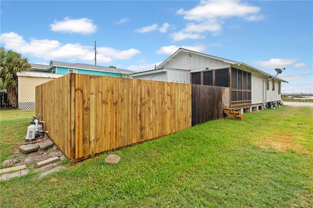 view of yard with a sunroom