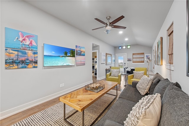 living room with lofted ceiling, hardwood / wood-style flooring, and ceiling fan