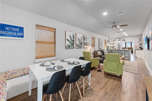 dining space with light wood-type flooring and ceiling fan