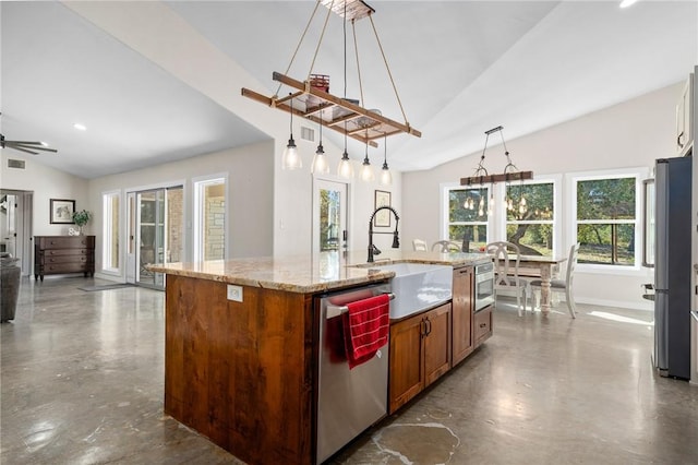 kitchen with stainless steel appliances, sink, hanging light fixtures, lofted ceiling, and an island with sink