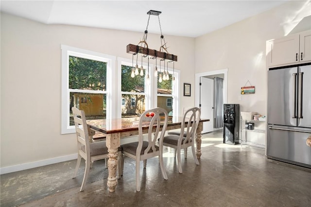 dining area featuring an inviting chandelier