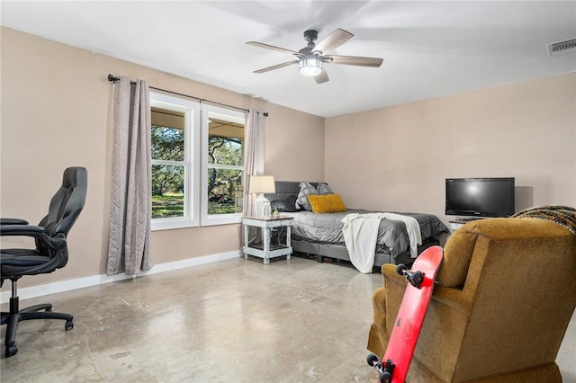 bedroom featuring ceiling fan and concrete floors