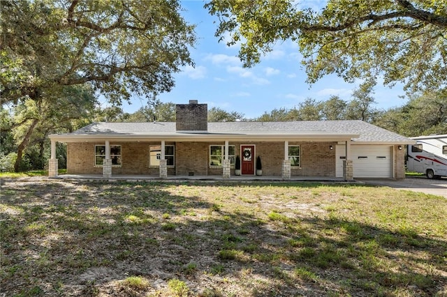 ranch-style home with a porch and a garage