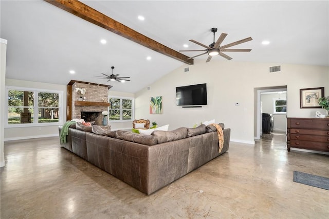 living room featuring ceiling fan, a fireplace, and lofted ceiling with beams