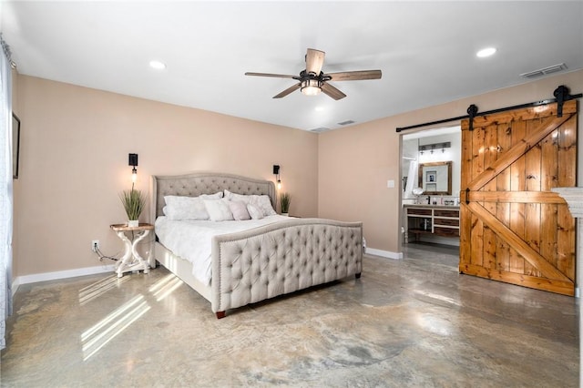 bedroom with ceiling fan and a barn door