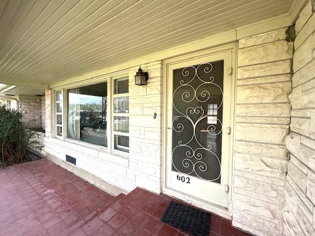 property entrance with a porch