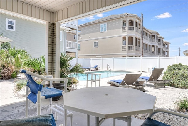 view of swimming pool with a patio area