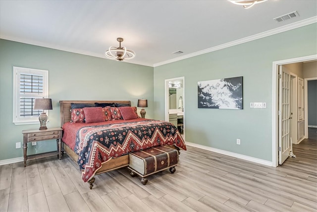 bedroom with ensuite bathroom, light hardwood / wood-style flooring, and ornamental molding