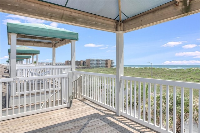 deck featuring a gazebo and a water view