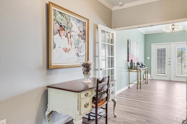 office area featuring light hardwood / wood-style floors, french doors, and ornamental molding