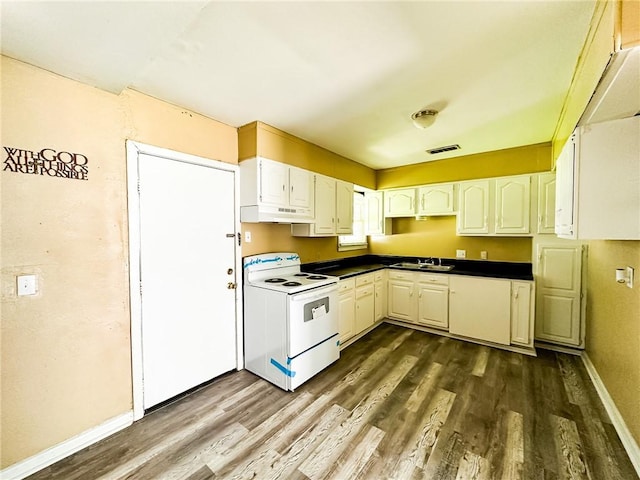 kitchen with dark wood finished floors, visible vents, under cabinet range hood, white range with electric stovetop, and a sink