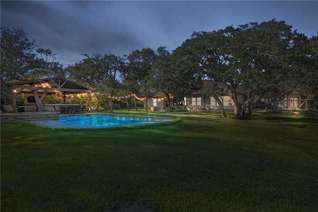 view of pool featuring a patio area, a lawn, and a gazebo