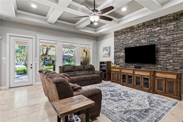 tiled living room with ceiling fan, beamed ceiling, ornamental molding, and coffered ceiling