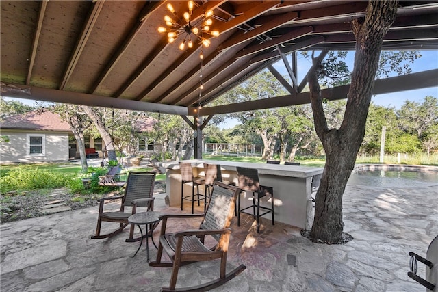 view of patio / terrace featuring an outdoor bar