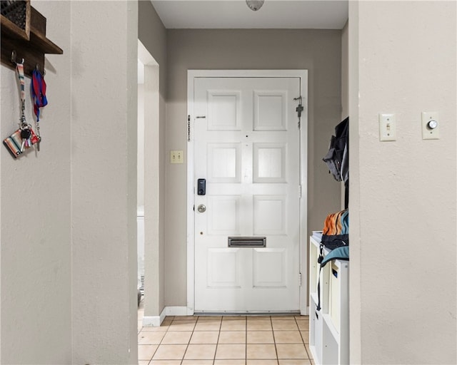 doorway featuring light tile patterned floors