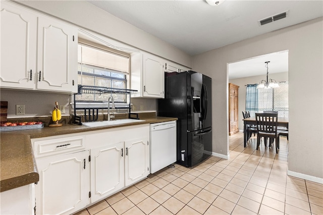 kitchen featuring white dishwasher, black refrigerator with ice dispenser, white cabinetry, and sink