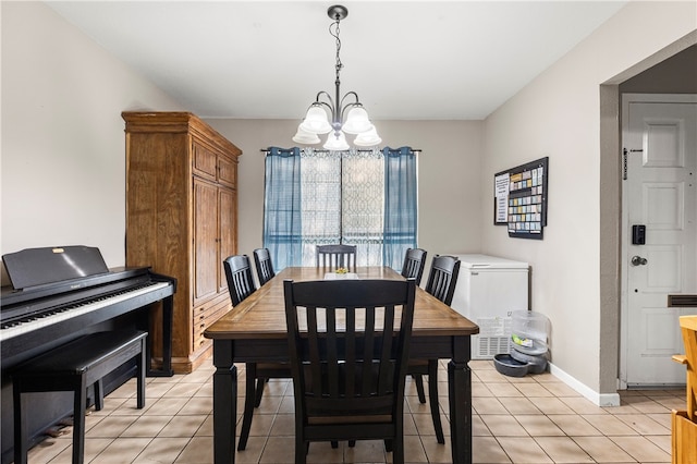 tiled dining room featuring a notable chandelier