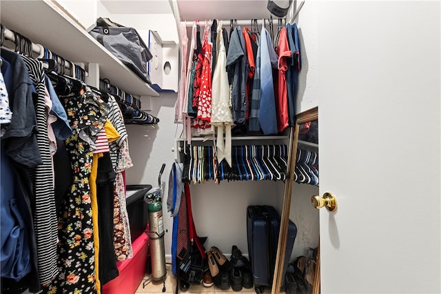 spacious closet with tile patterned flooring