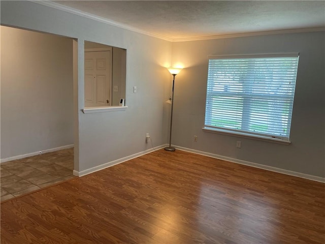 4513 Snead Dr, Corpus Christi, TX 78413 - unfurnished room featuring crown molding, wood finished floors, and baseboards