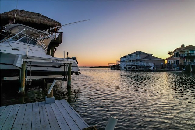view of dock featuring boat lift and a water view