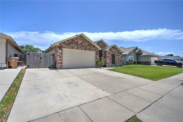 3918 Willow Heights Dr, Corpus Christi, TX 78410 - view of front facade featuring brick siding, a garage, driveway, and a gate