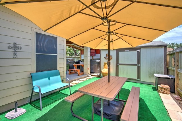 3918 Willow Heights Dr, Corpus Christi, TX 78410 - wooden deck featuring a storage shed and a patio