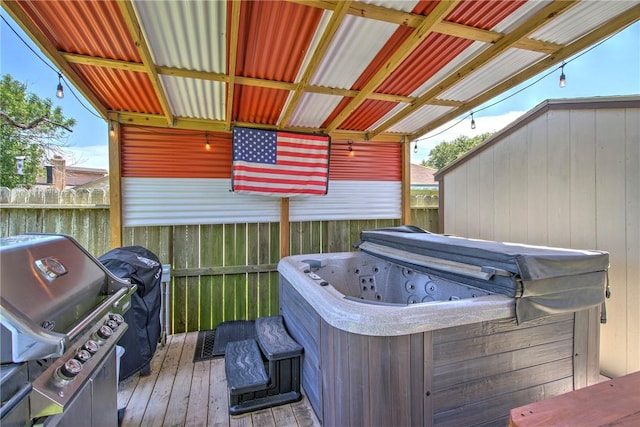 3918 Willow Heights Dr, Corpus Christi, TX 78410 - wooden deck with a hot tub and grilling area