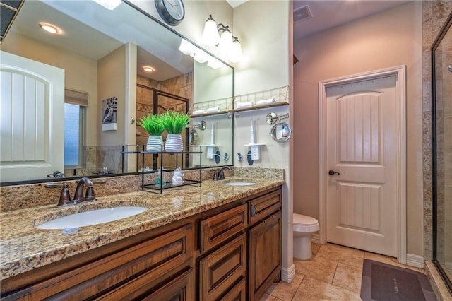 3918 Willow Heights Dr, Corpus Christi, TX 78410 - bathroom with a shower stall, double vanity, and tile patterned flooring