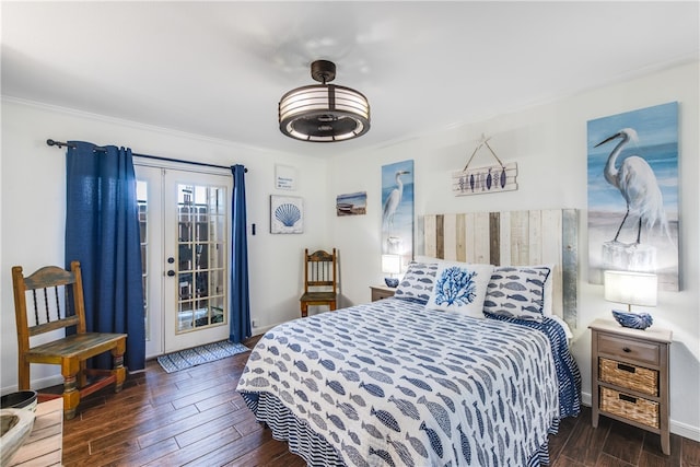 bedroom with access to exterior, dark hardwood / wood-style flooring, and crown molding