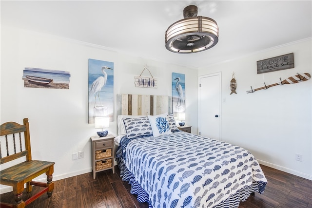 bedroom featuring ornamental molding and dark wood-type flooring