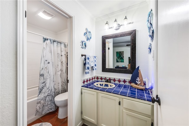 full bathroom featuring shower / bath combination with curtain, ornamental molding, vanity, hardwood / wood-style floors, and toilet