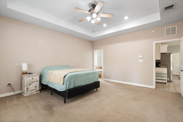2214 N Mccampbell St, Aransas Pass, TX 78336 - bedroom featuring freestanding refrigerator, light colored carpet, a raised ceiling, recessed lighting, and ceiling fan