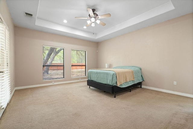 2214 N Mccampbell St, Aransas Pass, TX 78336 - bedroom with a tray ceiling, carpet floors, ceiling fan, and recessed lighting