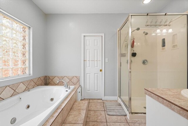 2214 N Mccampbell St, Aransas Pass, TX 78336 - bathroom featuring a stall shower, a jetted tub, healthy amount of natural light, vanity, and recessed lighting