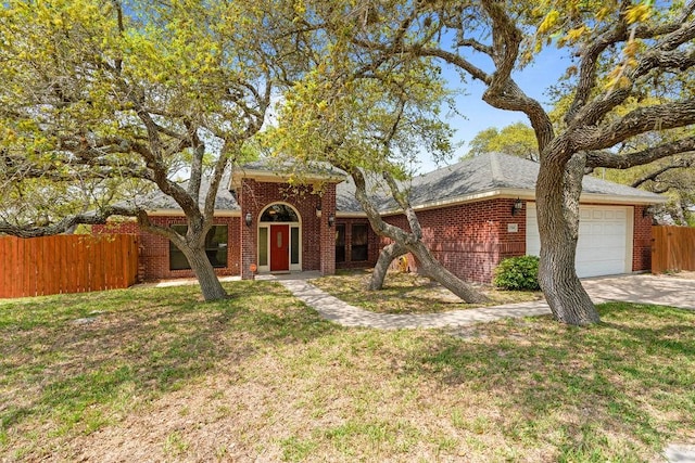2214 N Mccampbell St, Aransas Pass, TX 78336 - traditional-style house featuring an attached garage, concrete driveway, and brick siding