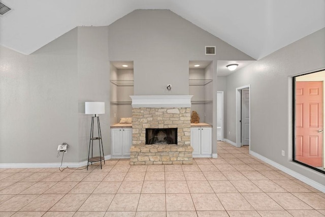 2214 N Mccampbell St, Aransas Pass, TX 78336 - unfurnished living room featuring light tile patterned floors, a fireplace, and high vaulted ceiling