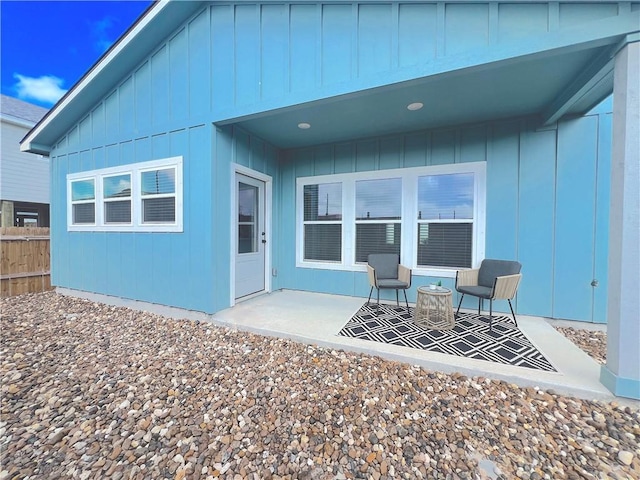 1931 Eskridge St, Port Aransas, TX 78373 - back of property featuring a patio area and board and batten siding