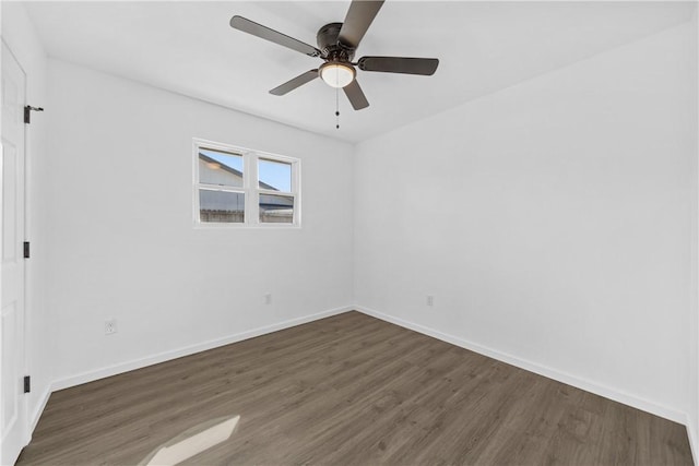 unfurnished room featuring ceiling fan and dark hardwood / wood-style floors