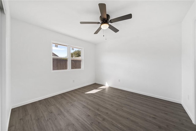 unfurnished room featuring ceiling fan and dark hardwood / wood-style floors