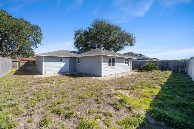 back of house with a yard