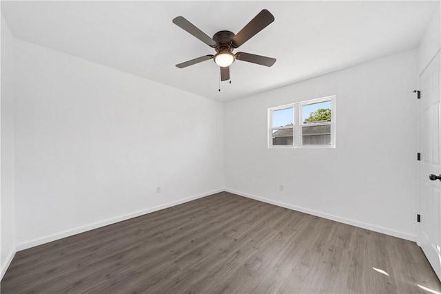 unfurnished room featuring ceiling fan and dark hardwood / wood-style floors