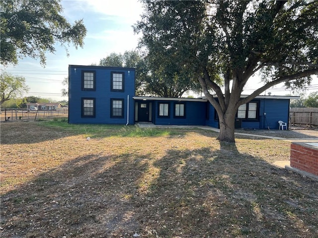 view of front of property featuring fence