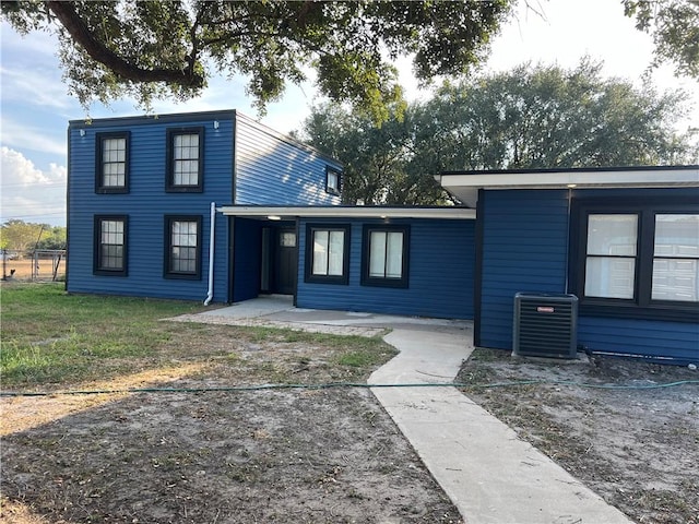 view of front of home featuring cooling unit