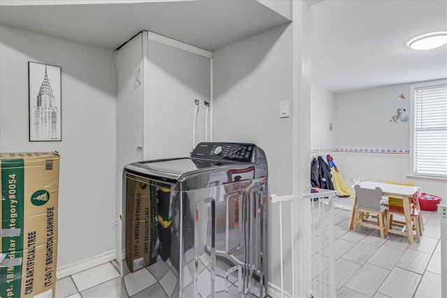 washroom with light tile patterned floors and washer / clothes dryer