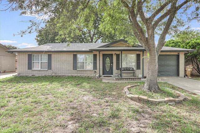 ranch-style home featuring a garage and a front yard