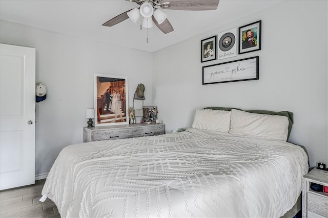 bedroom featuring hardwood / wood-style flooring and ceiling fan