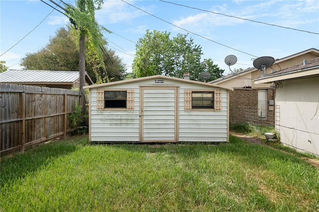 view of outdoor structure with a lawn