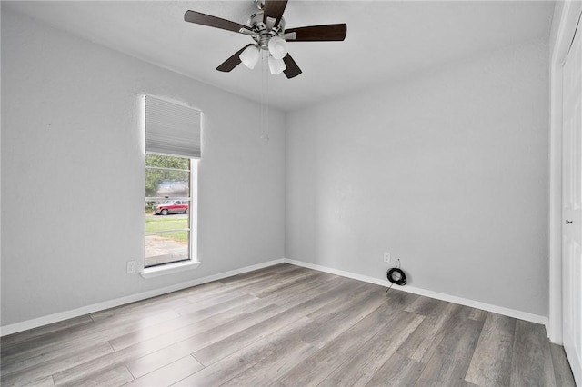 spare room with ceiling fan and light hardwood / wood-style flooring